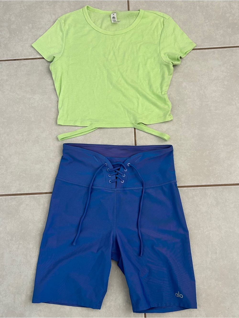 ALO Yoga Electric Blue Lace-Up High-Rise Sports Shorts and green top